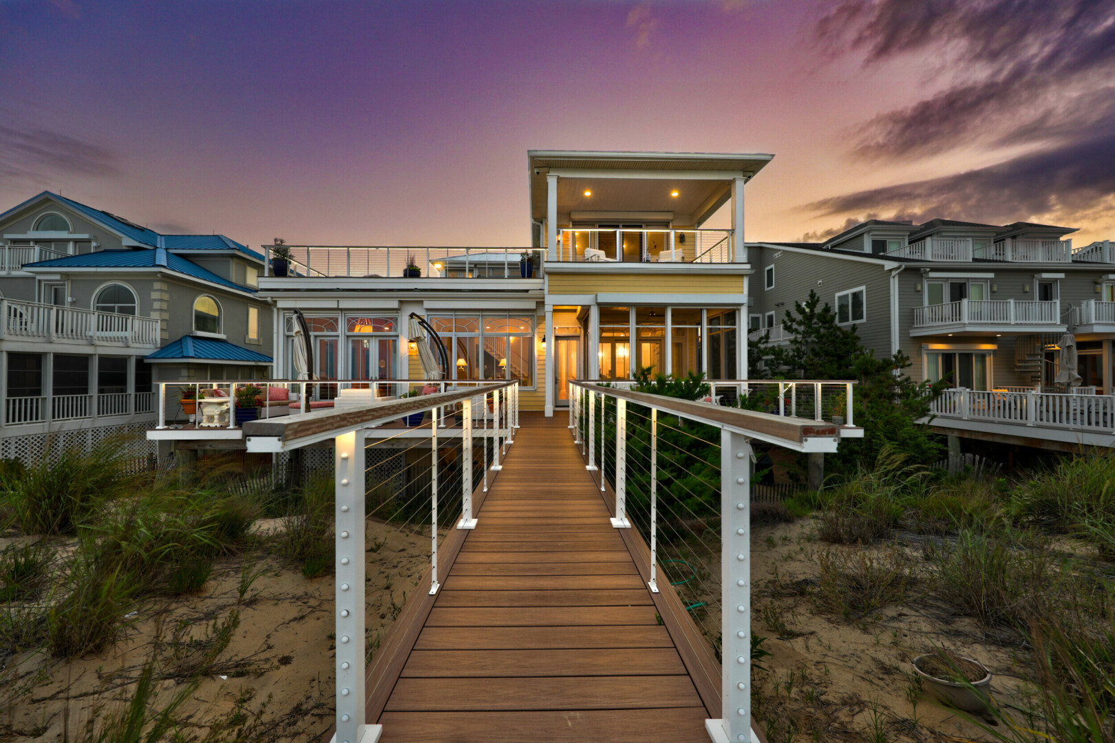 Rear view of modern custom home at dusk, Rehoboth Beach DE